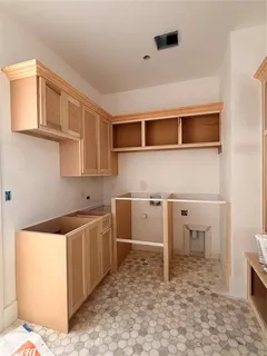 a spacious bathroom with a granite countertop sink a toilet and bathtub