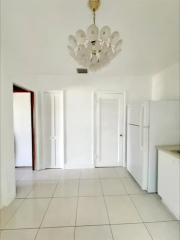 a view of an entryway with a chandelier