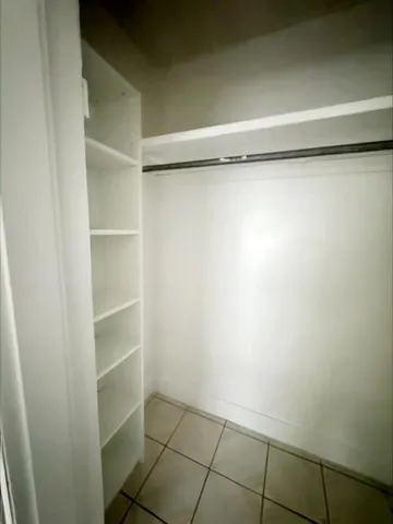 a view of an empty walk in closet