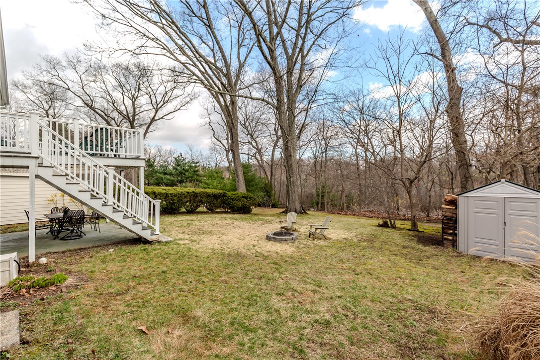 185 Parkside Avenue Pawtucket, RI 02861 - Photo 18 of 31 Yard with wooded backdrop