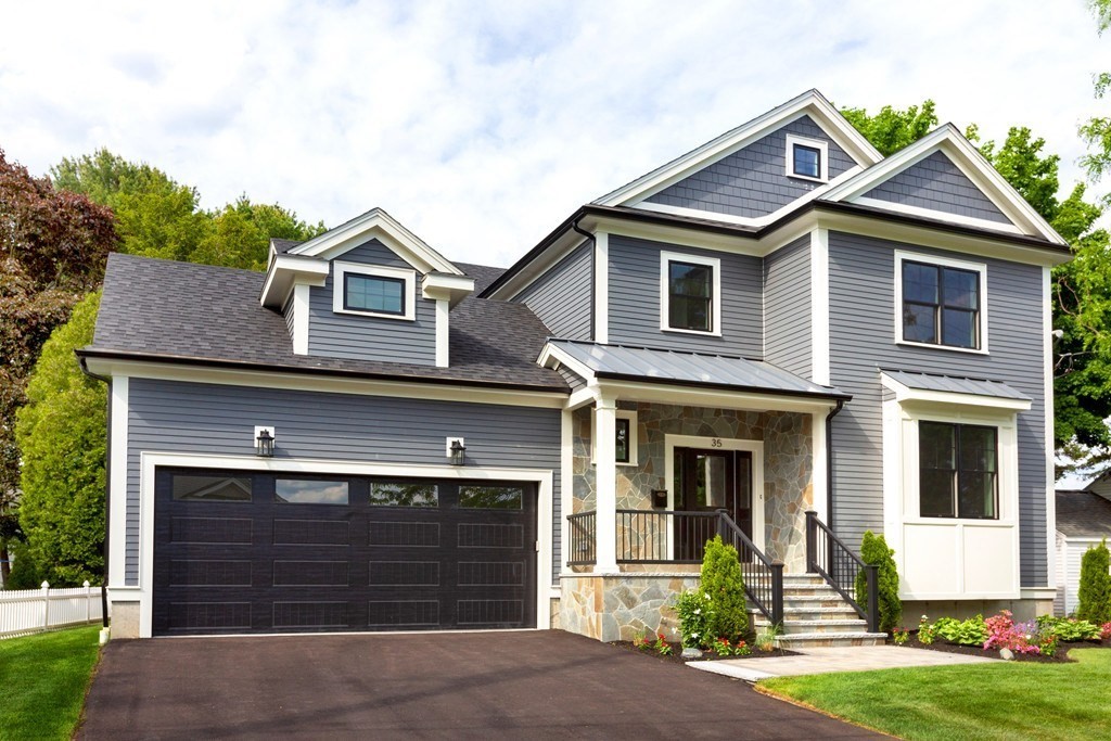 front view of a house with a yard