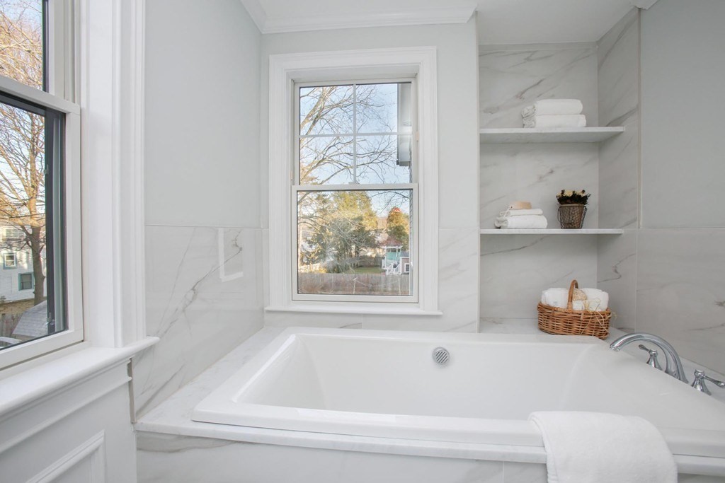 35 Hanson Road, Unit 35 Newton, MA 02459 - Photo 9 of 15 a bathroom with a bathtub and window