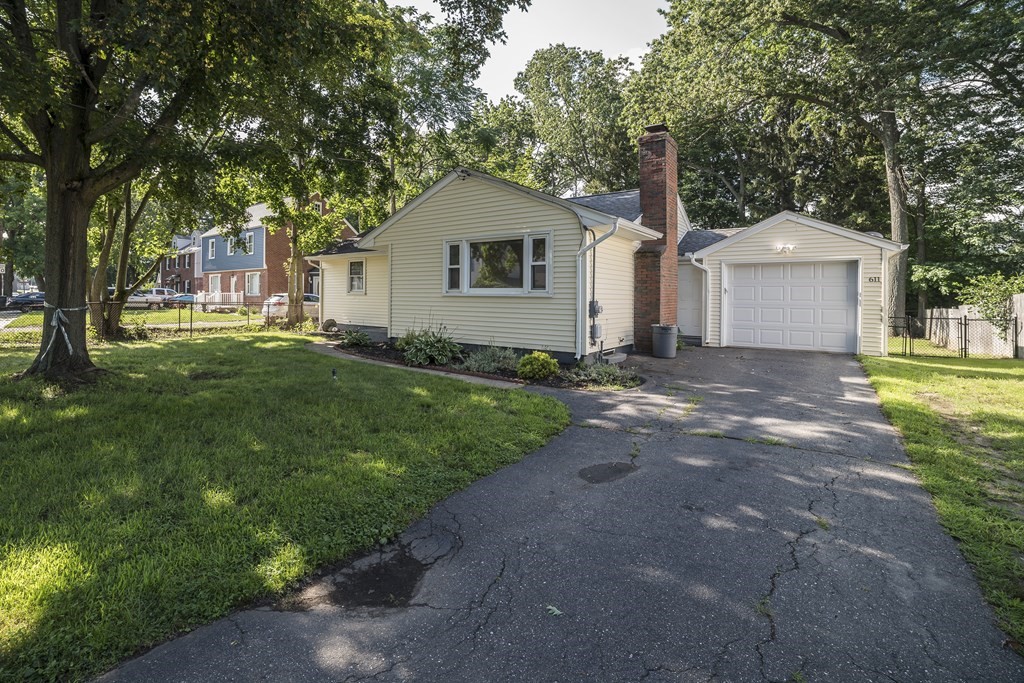 611 Allen Street Springfield, MA 01118 - Photo 2 of 37 a view of a house with a yard