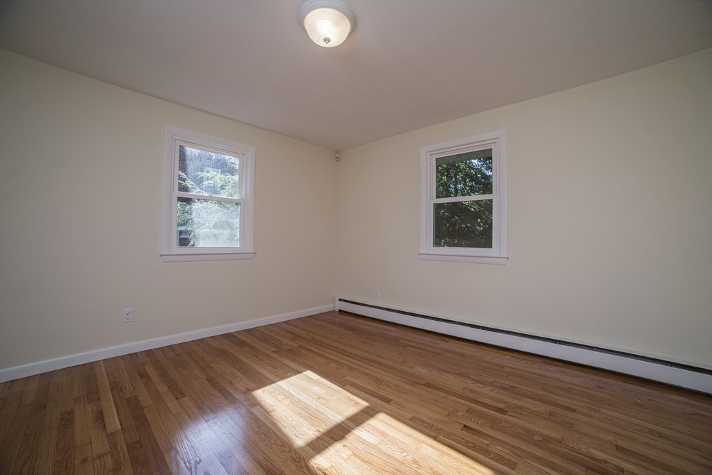 611 Allen Street Springfield, MA 01118 - Photo 28 of 37 a view of empty room with wooden floor and fan