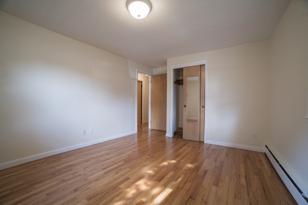 611 Allen Street Springfield, MA 01118 - Photo 34 of 37 a view of an empty room with wooden floor