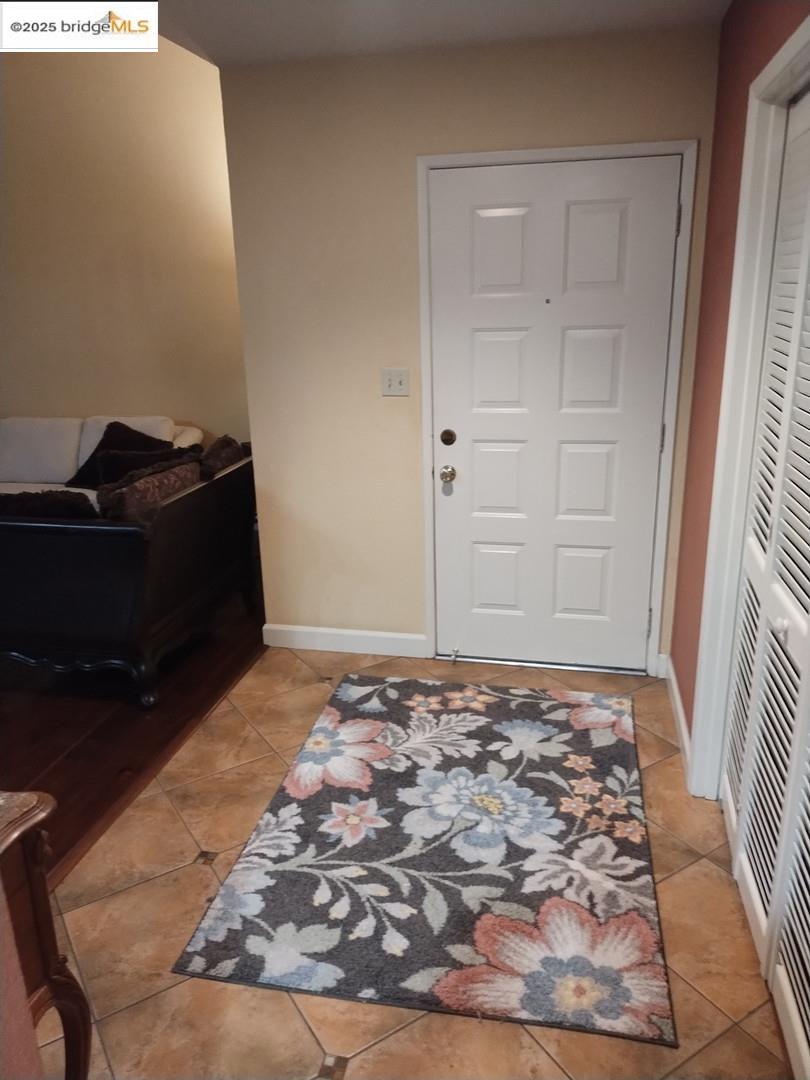 a view of an empty room and wooden floor