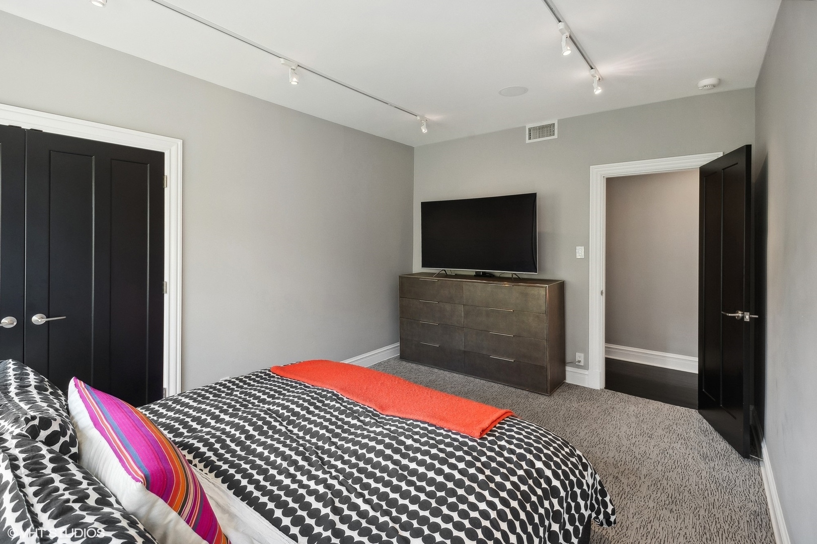 400 West Briar Place, Unit 3C Chicago, IL 60657 - Photo 12 of 21 a bedroom with a bed and a flat screen tv