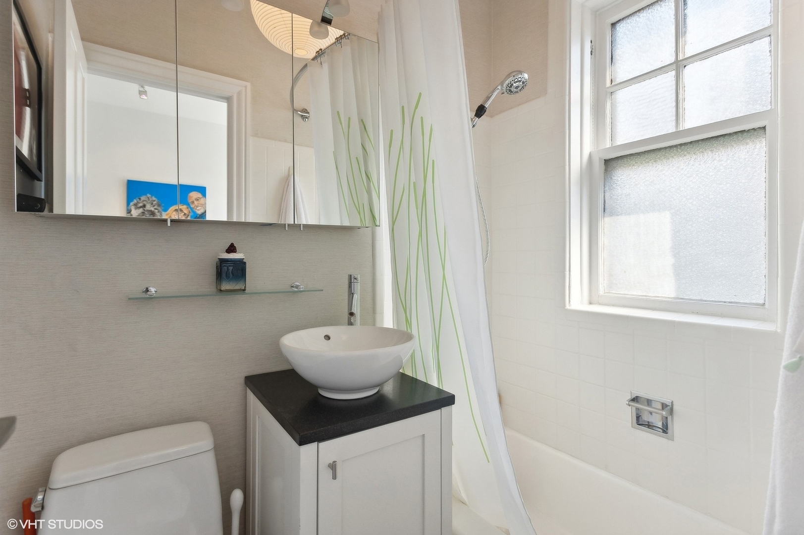 400 West Briar Place, Unit 3C Chicago, IL 60657 - Photo 16 of 21 a bathroom with a toilet a sink and a mirror
