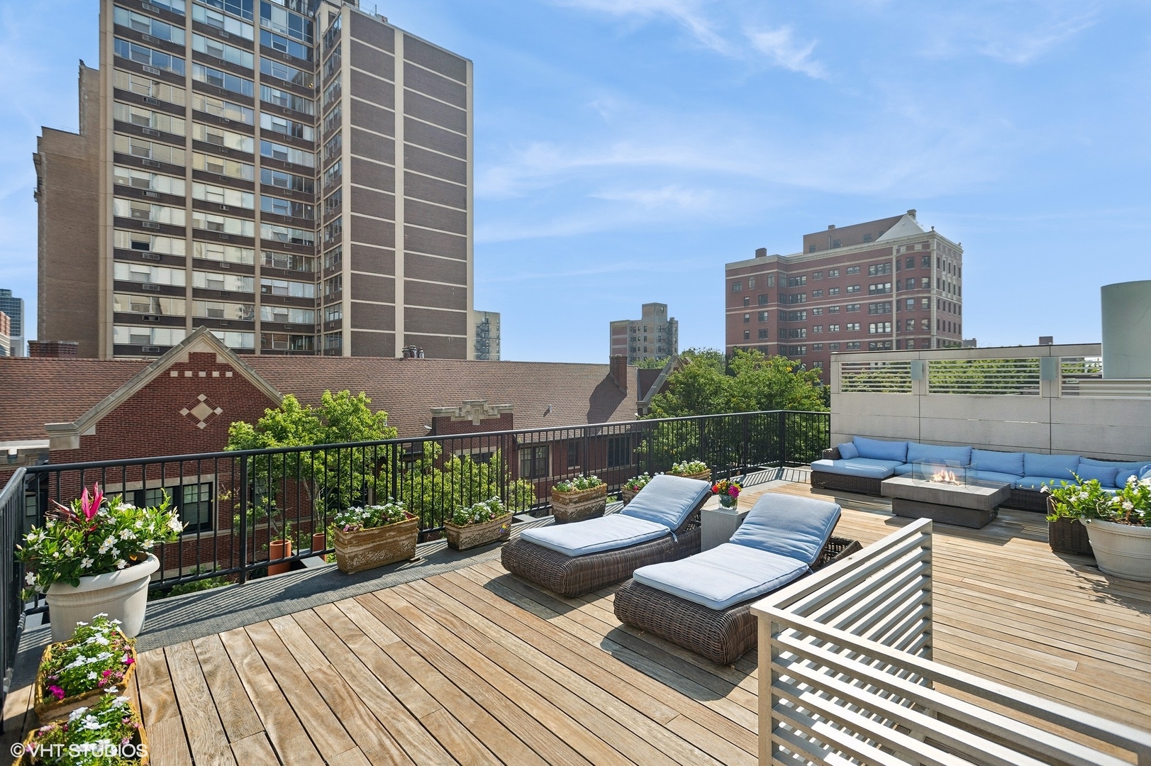 400 West Briar Place, Unit 3C Chicago, IL 60657 - Photo 18 of 21 a view of a roof deck with couches and potted plants