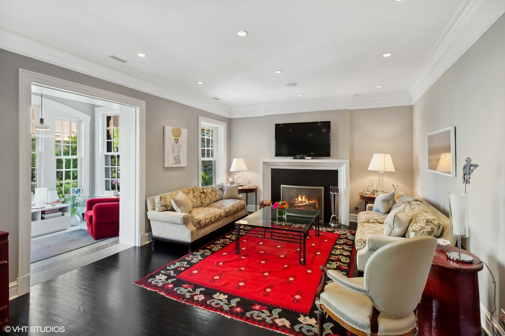 400 West Briar Place, Unit 3C Chicago, IL 60657 - Photo 2 of 21 a living room with furniture a flat screen tv and a fireplace