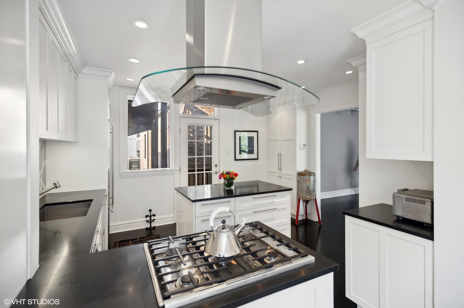 400 West Briar Place, Unit 3C Chicago, IL 60657 - Photo 8 of 21 a kitchen with stainless steel appliances granite countertop a sink stove and refrigerator