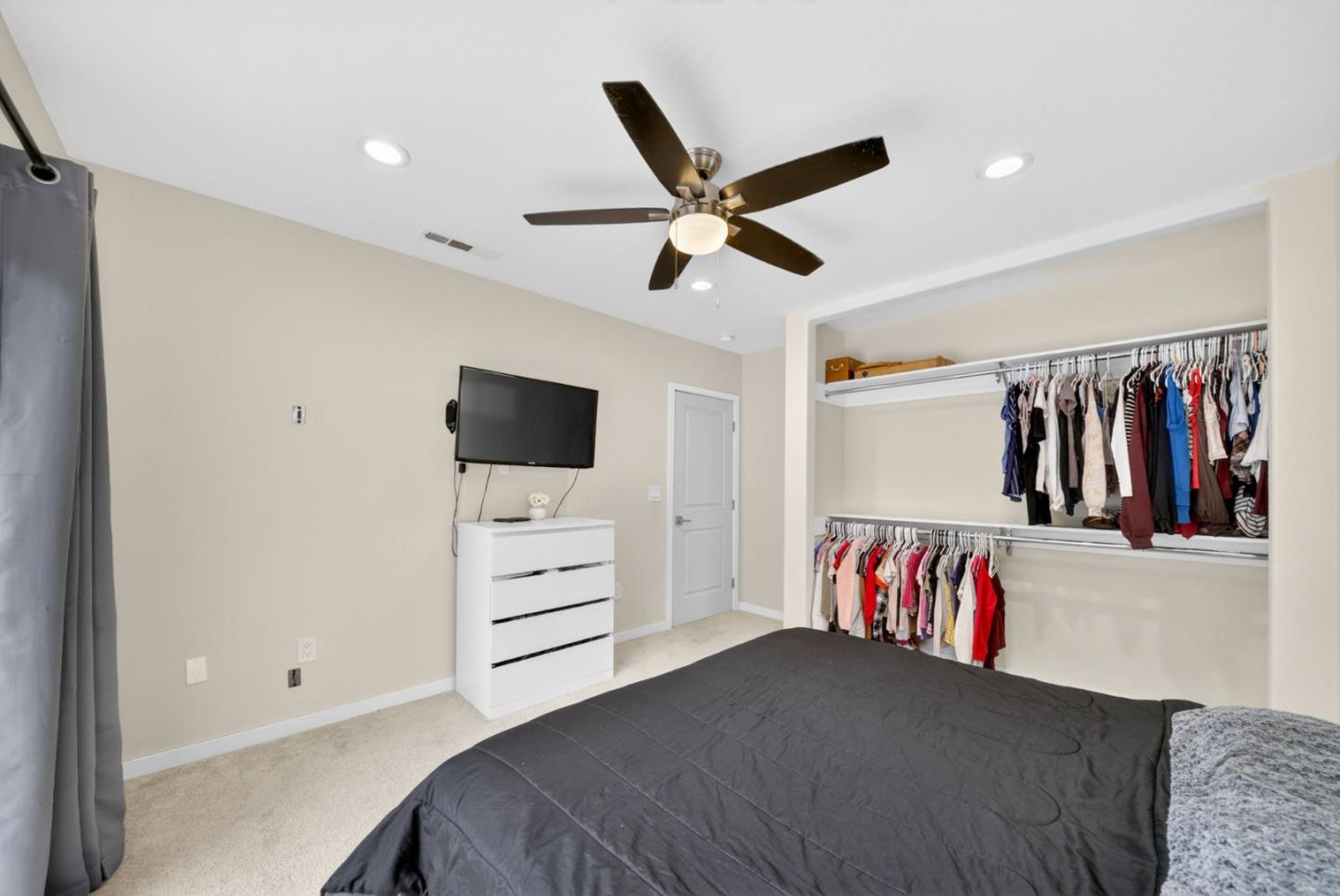 919 Old Canyon Road Fremont, CA 94536 - Photo 22 of 55 a bedroom with a bed and a flat screen tv