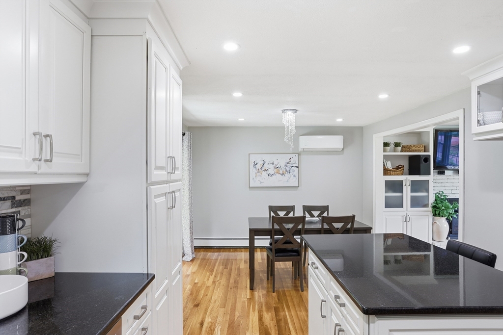 33 Simon Willard Road Acton, MA 01720 - Photo 10 of 42 a view of a kitchen with kitchen island a counter top space a sink and cabinets