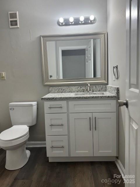 308 Hoskins Mill Lane, Unit H Charlotte, NC 28208 - Photo 11 of 12 a bathroom with a sink toilet vanity and mirror
