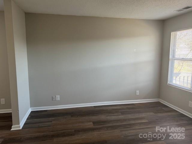 308 Hoskins Mill Lane, Unit H Charlotte, NC 28208 - Photo 12 of 12 a view of an empty room with wooden floor and a window