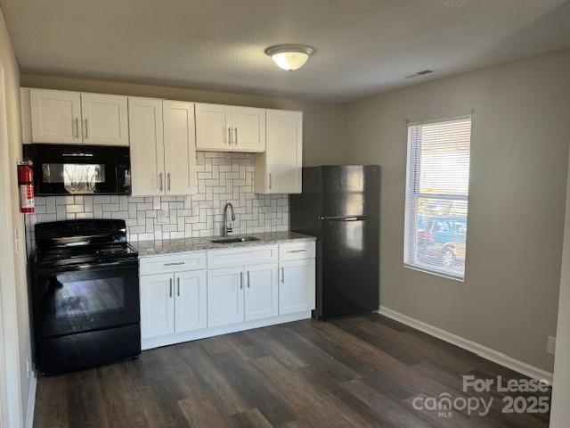 308 Hoskins Mill Lane, Unit H Charlotte, NC 28208 - Photo 3 of 12 a kitchen with granite countertop white cabinets a refrigerator and a stove