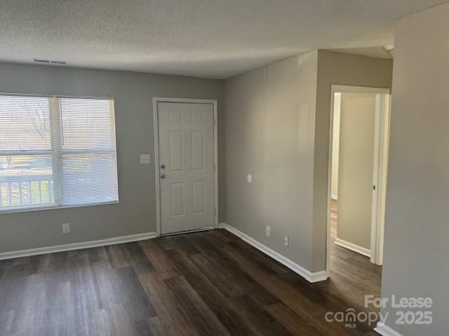 308 Hoskins Mill Lane, Unit H Charlotte, NC 28208 - Photo 6 of 12 an empty room with wooden floor and windows
