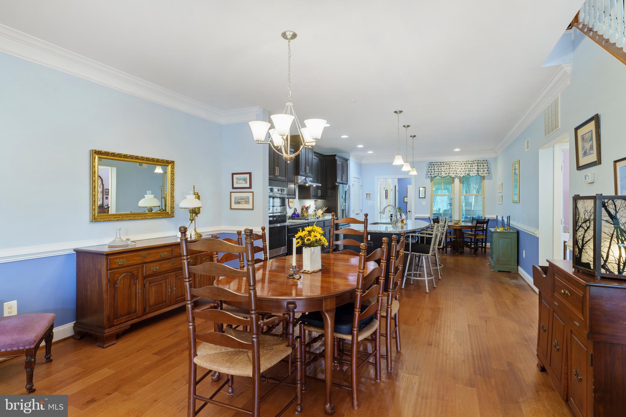 6926 Summit Circle Baltimore, MD 21239 - Photo 12 of 52 Formal dining room with chair and crown molding