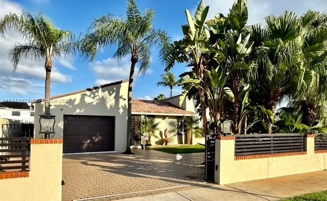 a front view of a building with garden