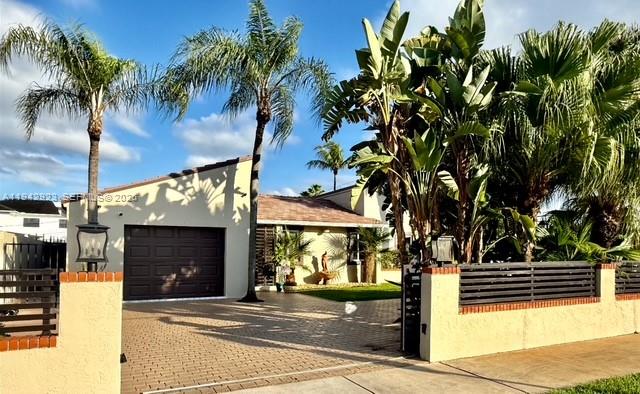a front view of a building with garden