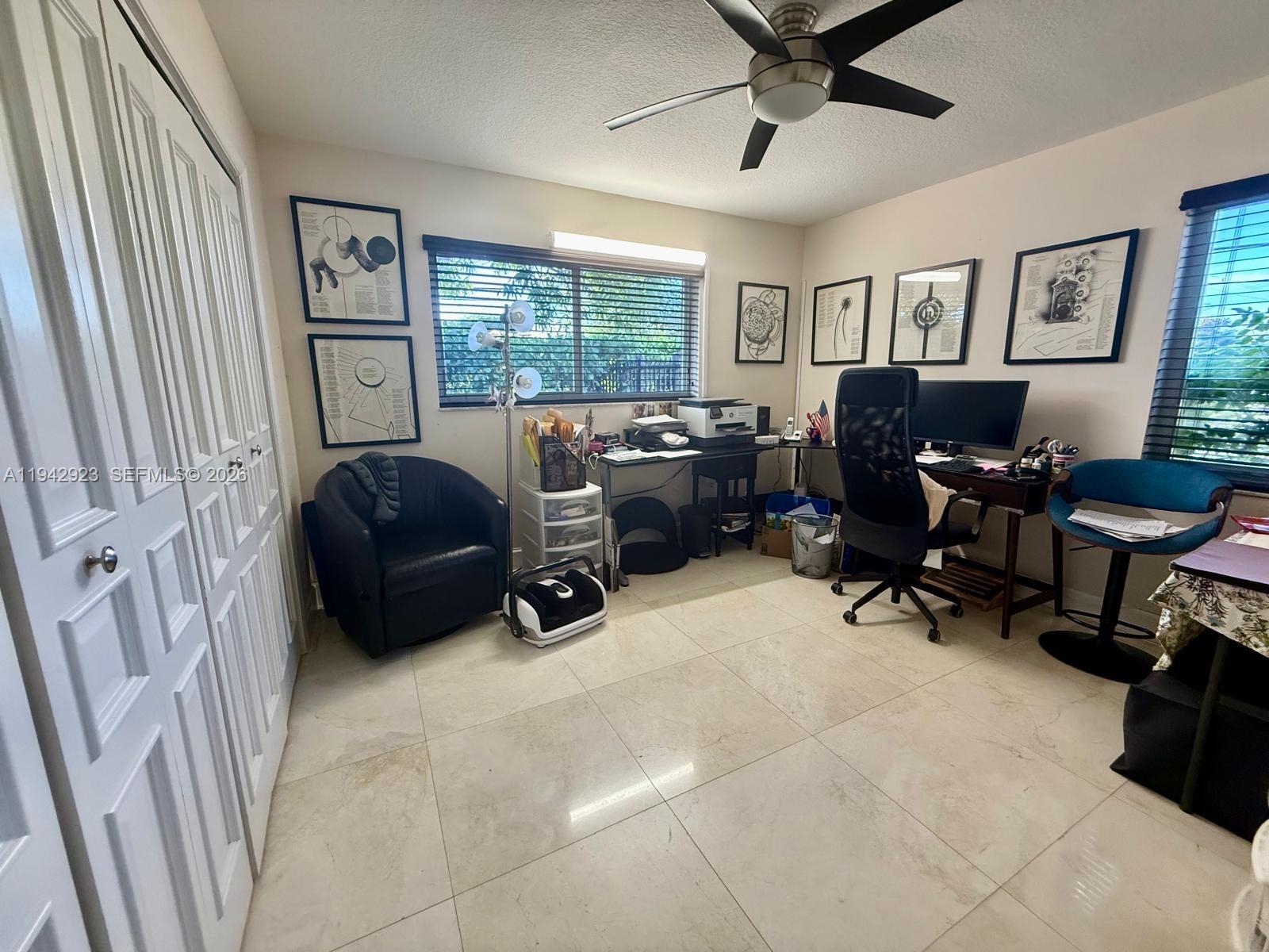 2725 Southwest 102nd Avenue Miami, FL 33165 - Photo 19 of 34 a view of a livingroom with workspace and a window
