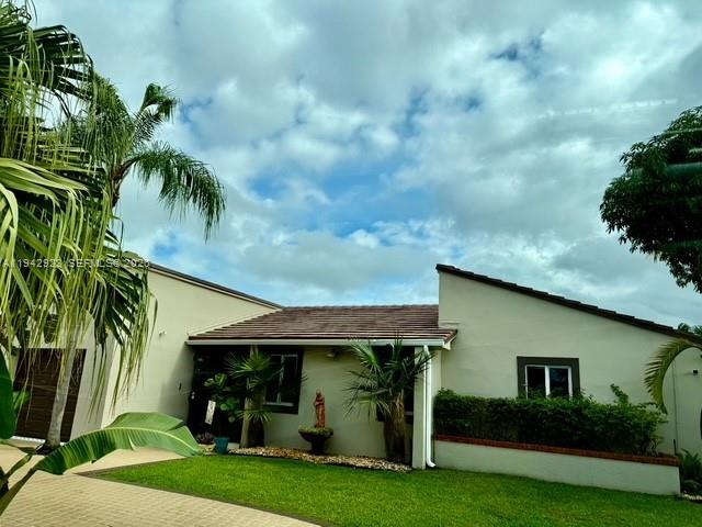 2725 Southwest 102nd Avenue Miami, FL 33165 - Photo 3 of 34 a view of a yard in front of a house