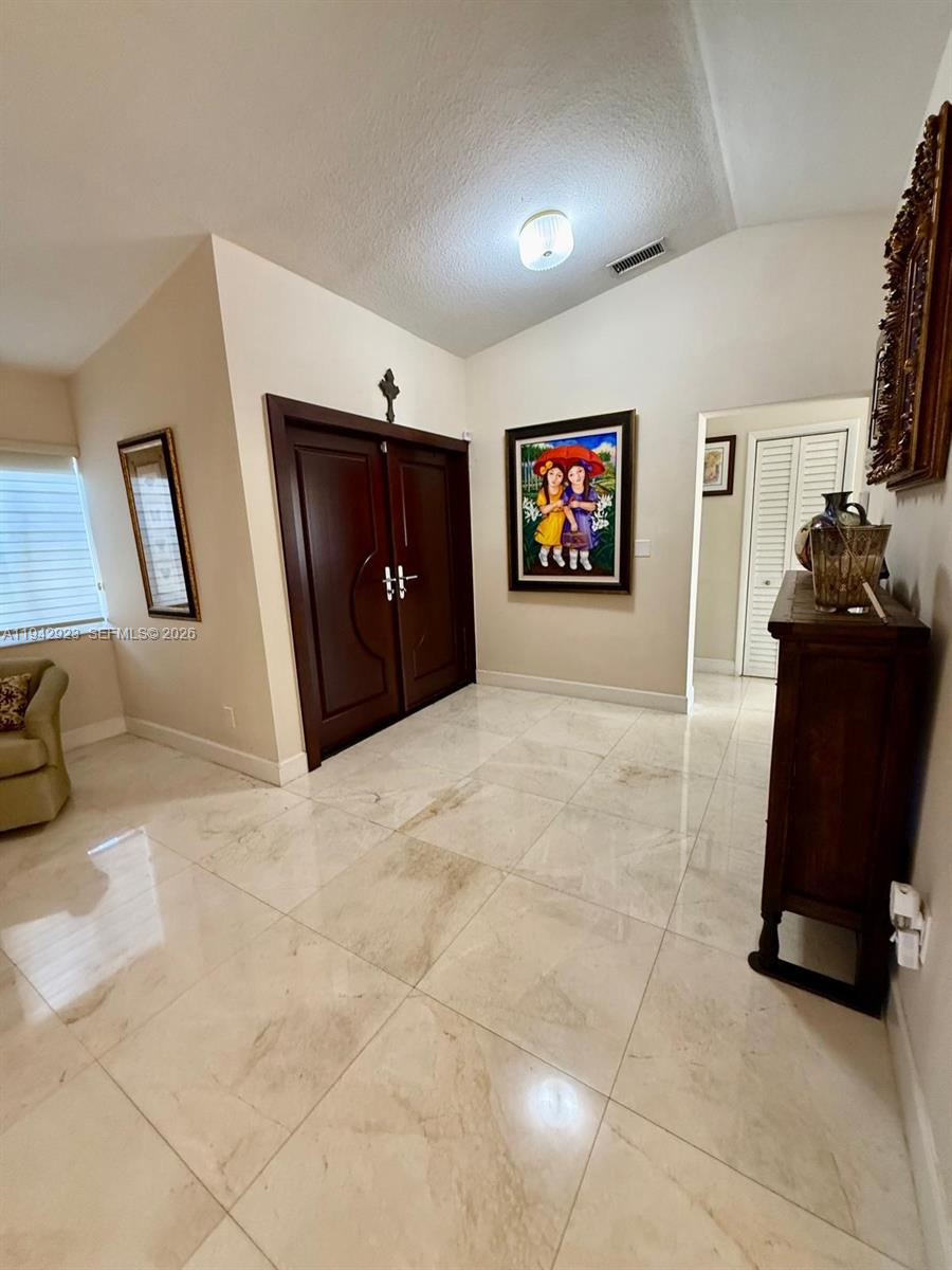 2725 Southwest 102nd Avenue Miami, FL 33165 - Photo 7 of 34 a view of a livingroom with furniture and workspace