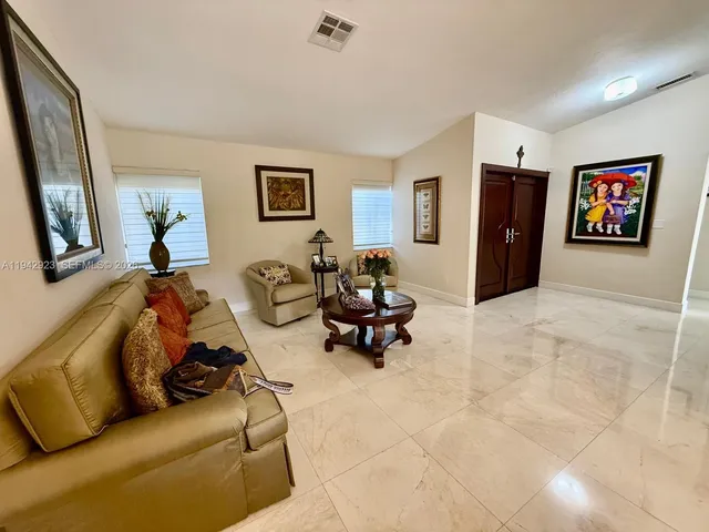 a living room with furniture and a rug