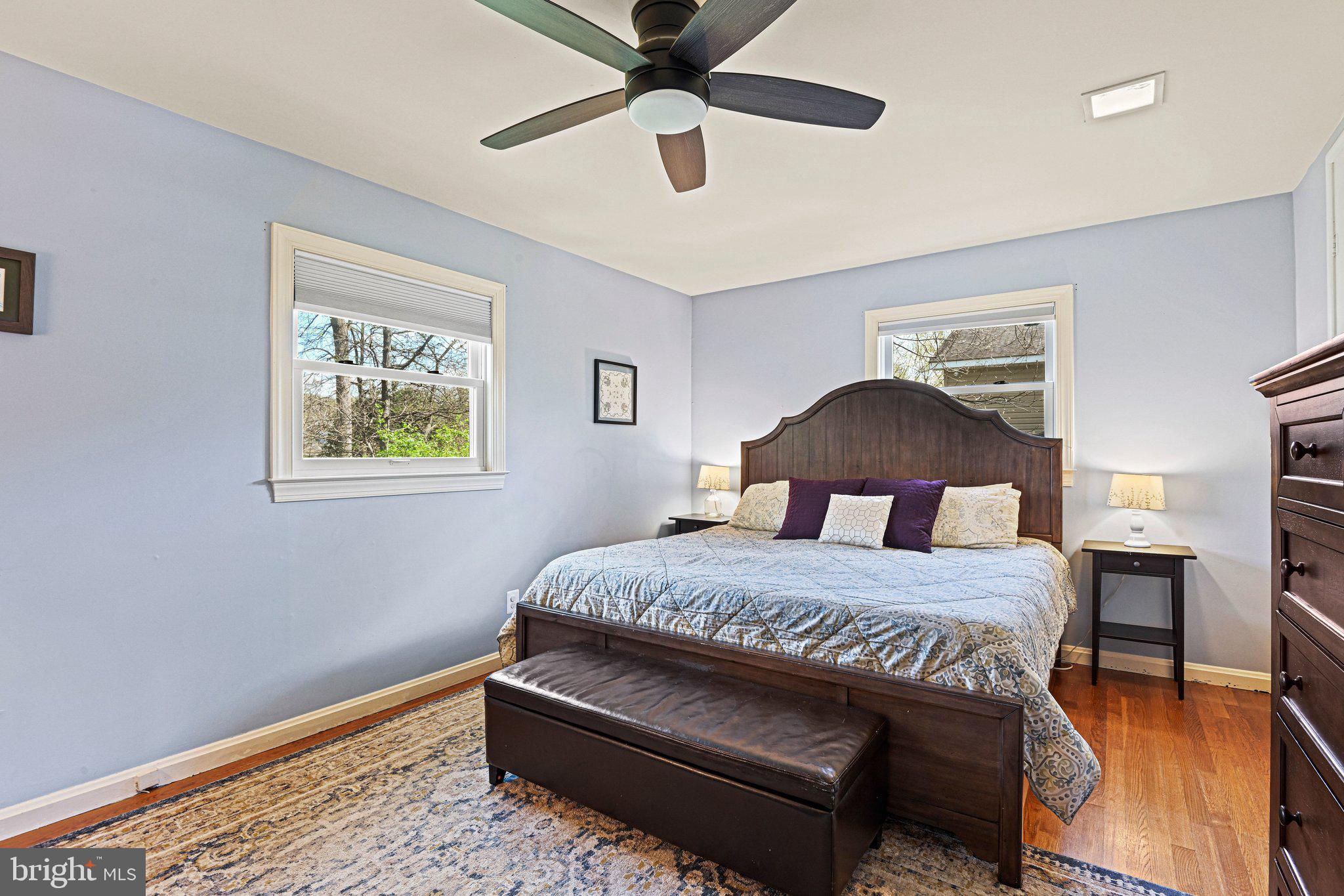 909 Plum Street Southwest Vienna, VA 22180 - Photo 15 of 38 a bedroom with a bed and a table