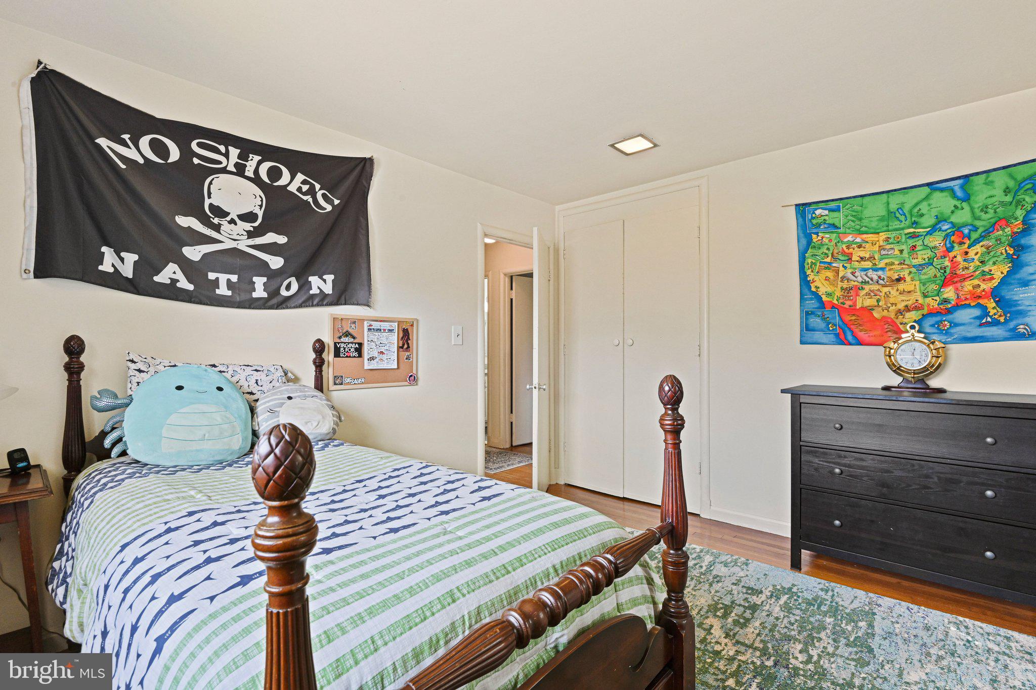 909 Plum Street Southwest Vienna, VA 22180 - Photo 21 of 38 a bedroom with a bed and a dresser in it