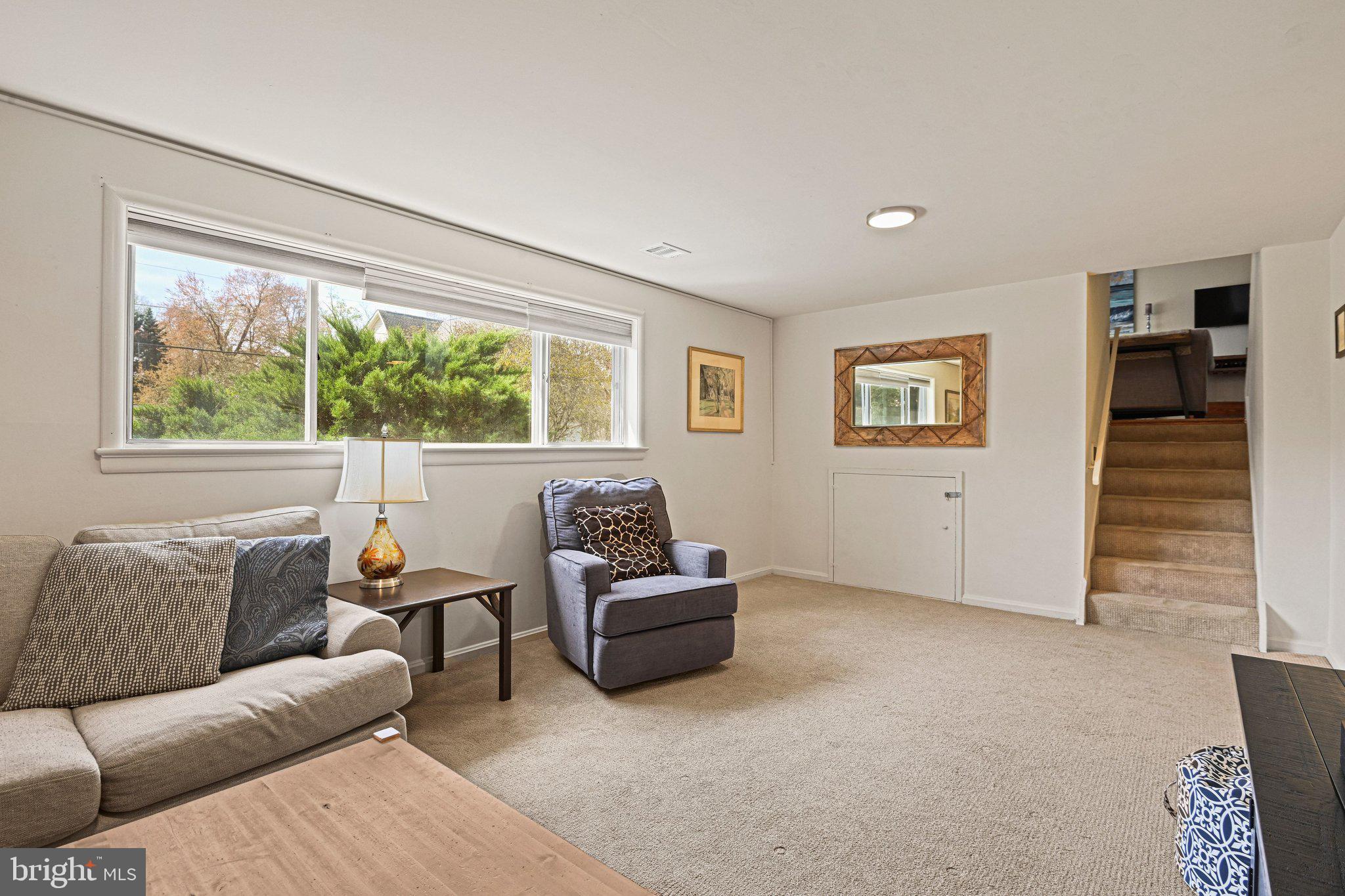 909 Plum Street Southwest Vienna, VA 22180 - Photo 24 of 38 a living room with furniture and a window