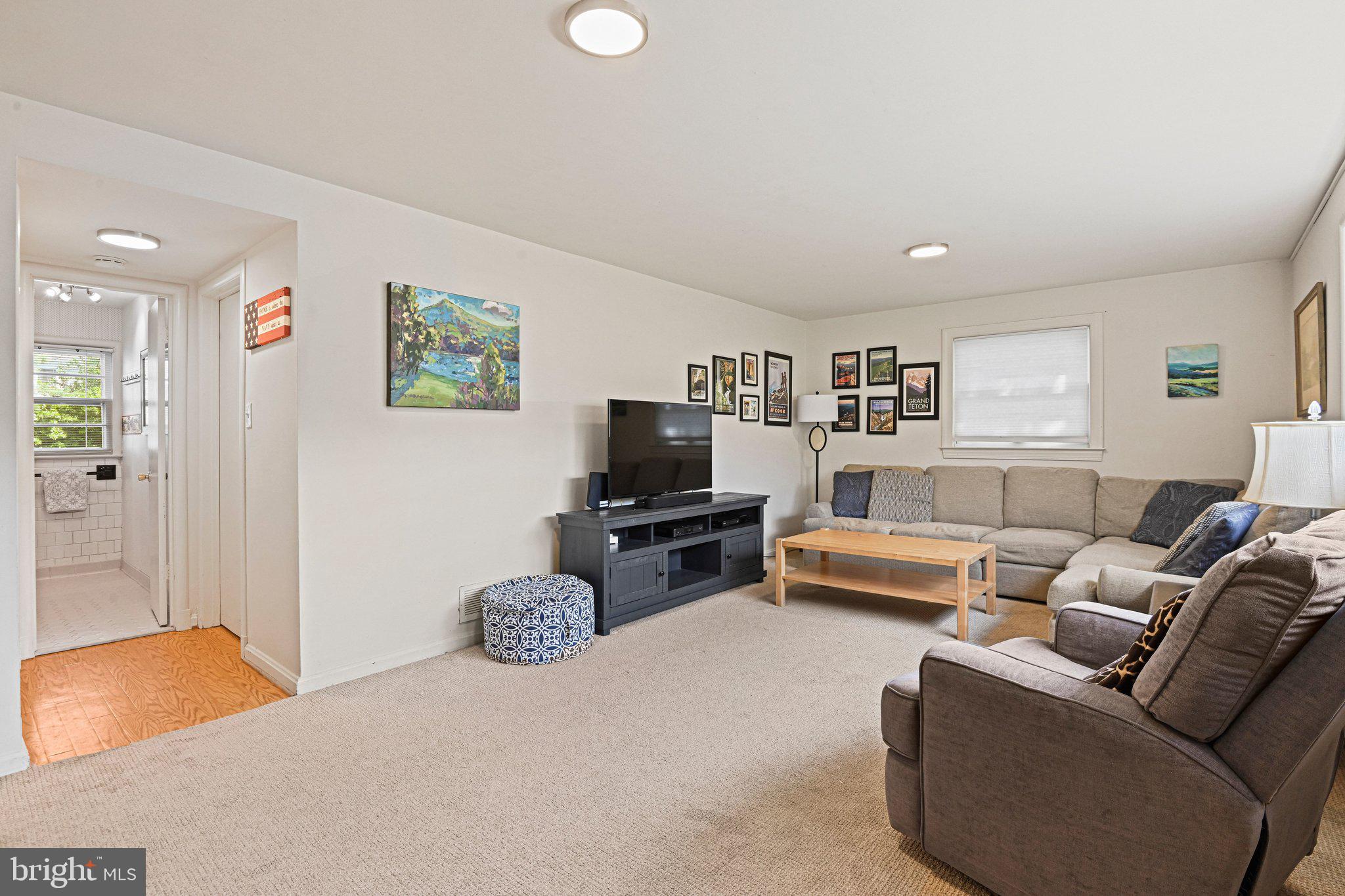 909 Plum Street Southwest Vienna, VA 22180 - Photo 25 of 38 a living room with furniture and a flat screen tv