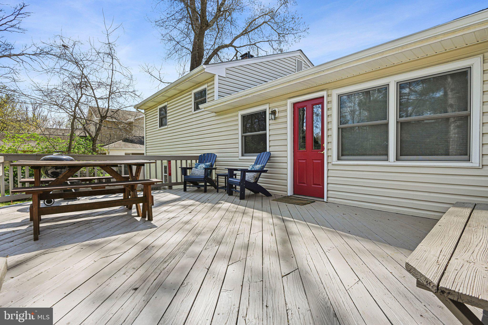 909 Plum Street Southwest Vienna, VA 22180 - Photo 30 of 38 a view of a roof deck with wooden floor and seating space
