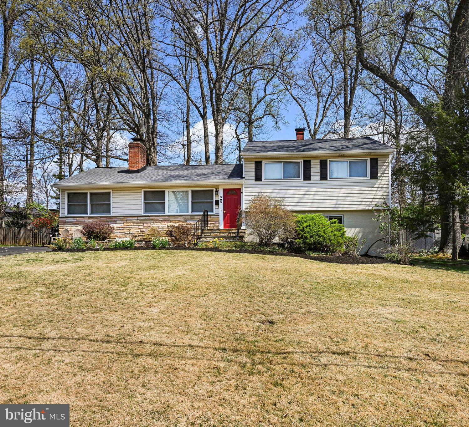 909 Plum Street Southwest Vienna, VA 22180 - Photo 3 of 38 a front view of a house with a yard