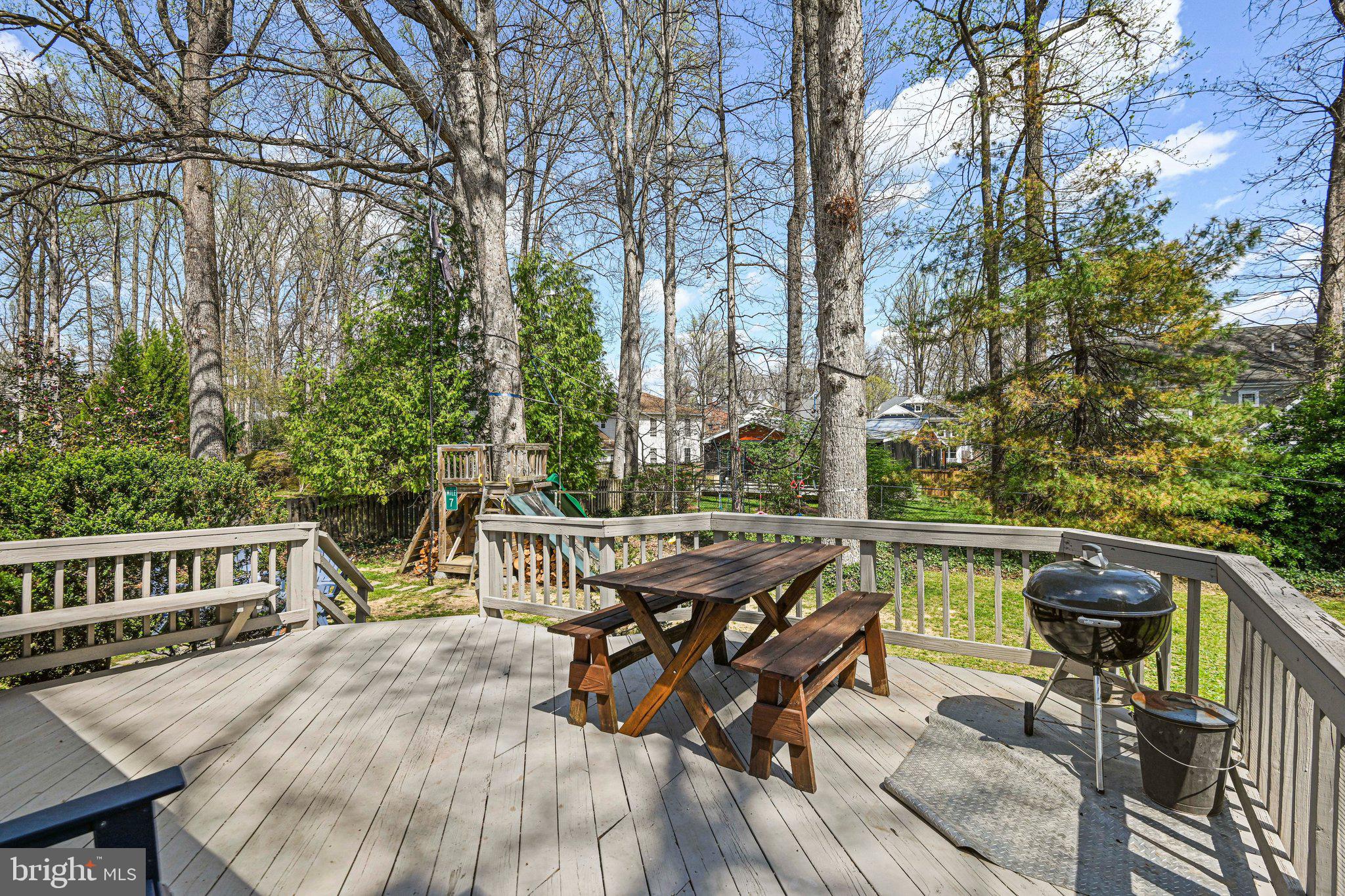 909 Plum Street Southwest Vienna, VA 22180 - Photo 32 of 38 a view of a chairs and table on the deck