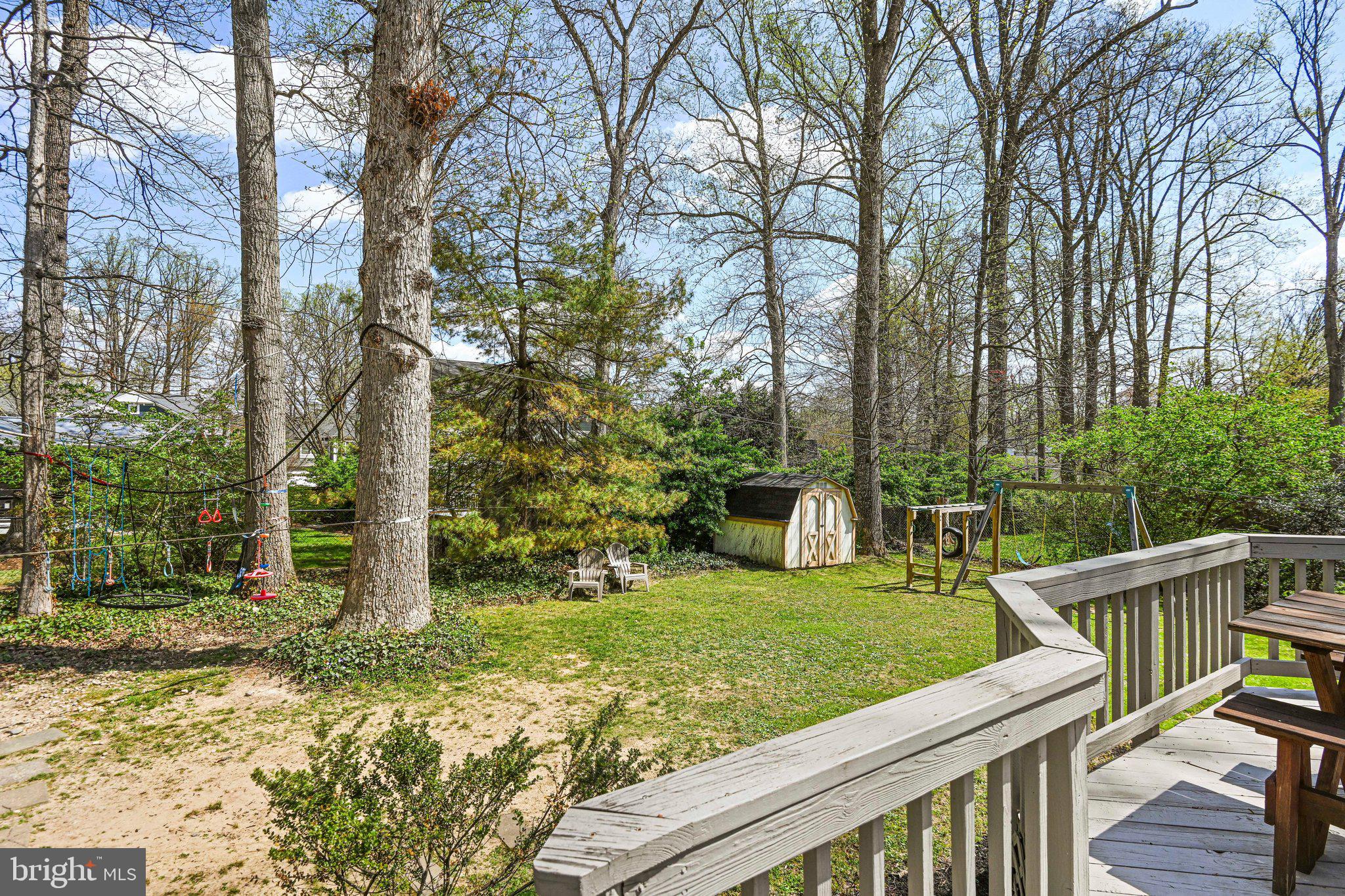 909 Plum Street Southwest Vienna, VA 22180 - Photo 33 of 38 a view of house with backyard outdoor seating and trees