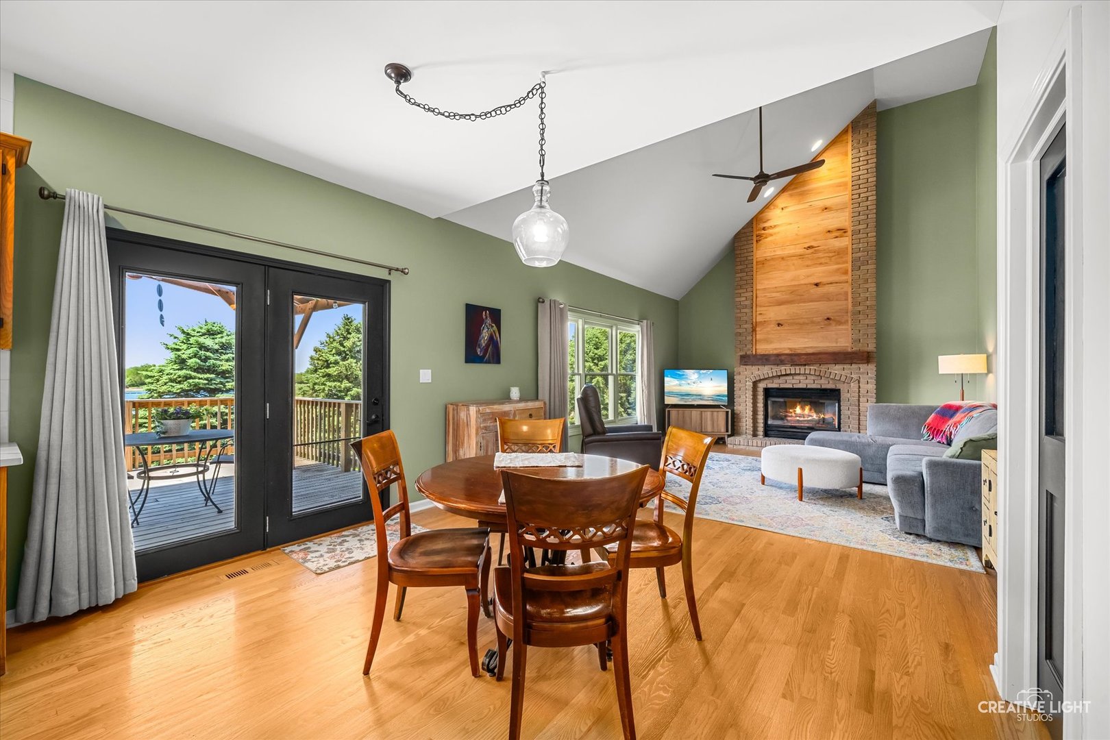 13495 Fennel Road Newark, IL 60541 - Photo 12 of 43 a dining room with furniture a fireplace and wooden floor