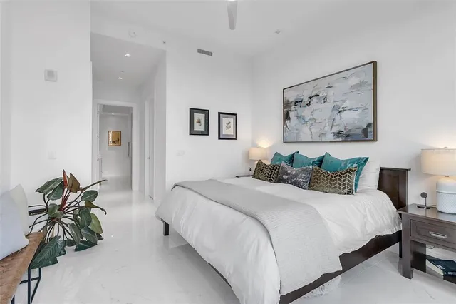 a bathroom with a shower sink vanity and mirror
