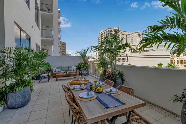 a lobby with furniture and a potted plant