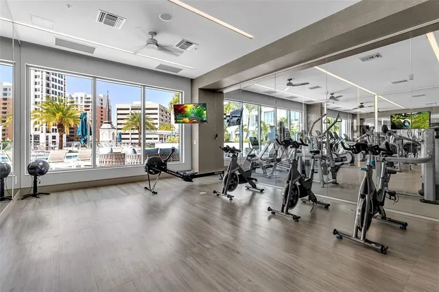 a building outdoor space with patio furniture and potted plants