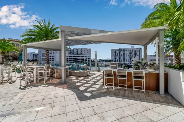 a swimming pool with outdoor seating and yard