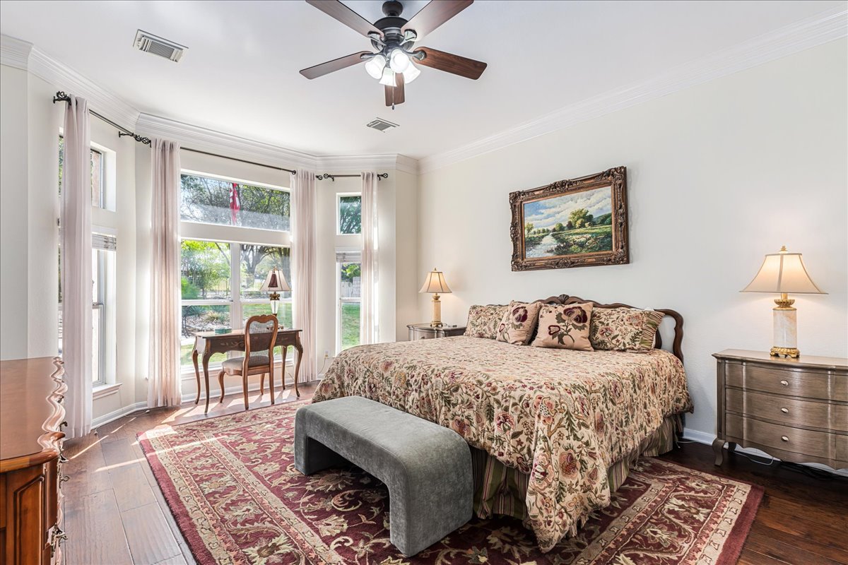 58 Cottondale Road The Hills, TX 78738 - Photo 14 of 40 a bedroom with a bed a couch and a potted plant