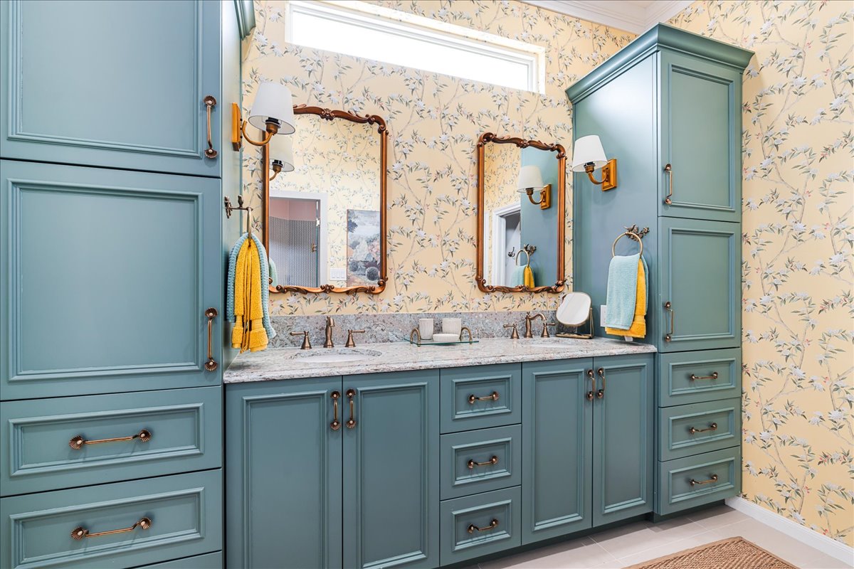 58 Cottondale Road The Hills, TX 78738 - Photo 16 of 40 a bathroom with a granite countertop sink and a mirror