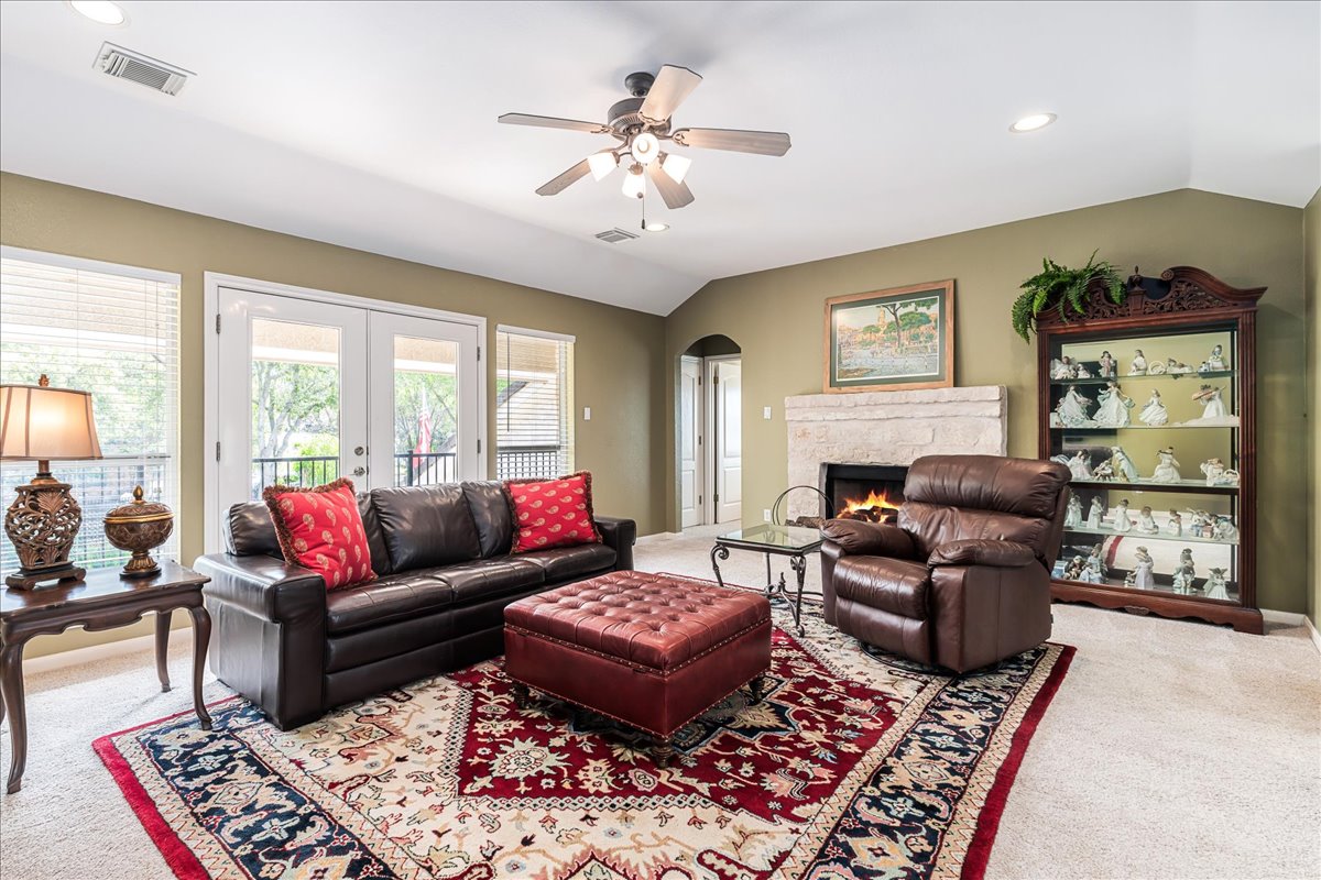 58 Cottondale Road The Hills, TX 78738 - Photo 18 of 40 a living room with furniture and a fireplace