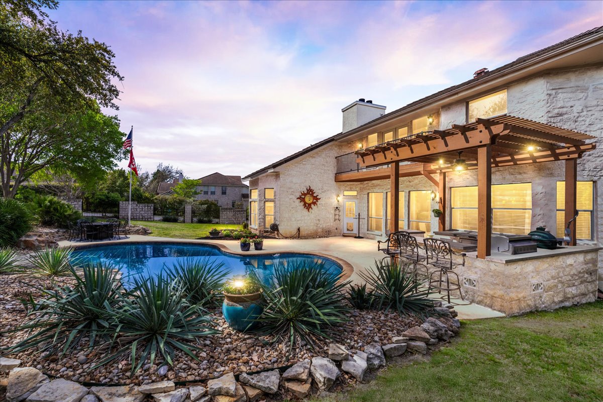 58 Cottondale Road The Hills, TX 78738 - Photo 2 of 40 a view of a house with pool and sitting area