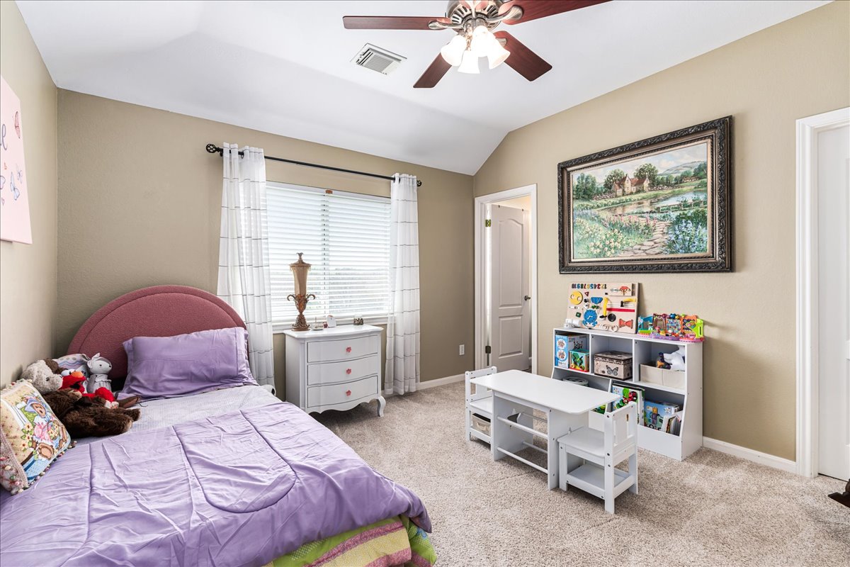 58 Cottondale Road The Hills, TX 78738 - Photo 22 of 40 a bedroom with a bed and furniture