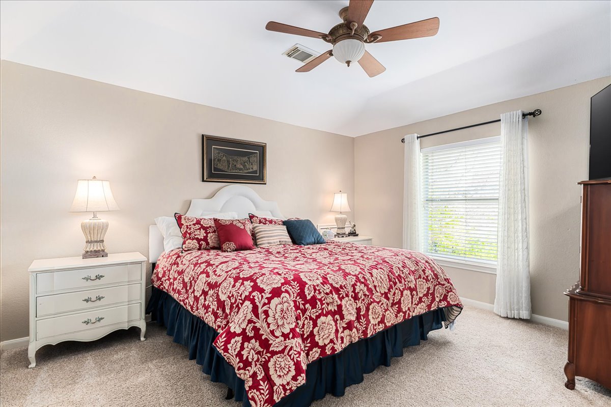 58 Cottondale Road The Hills, TX 78738 - Photo 24 of 40 a bedroom with a bed and a window