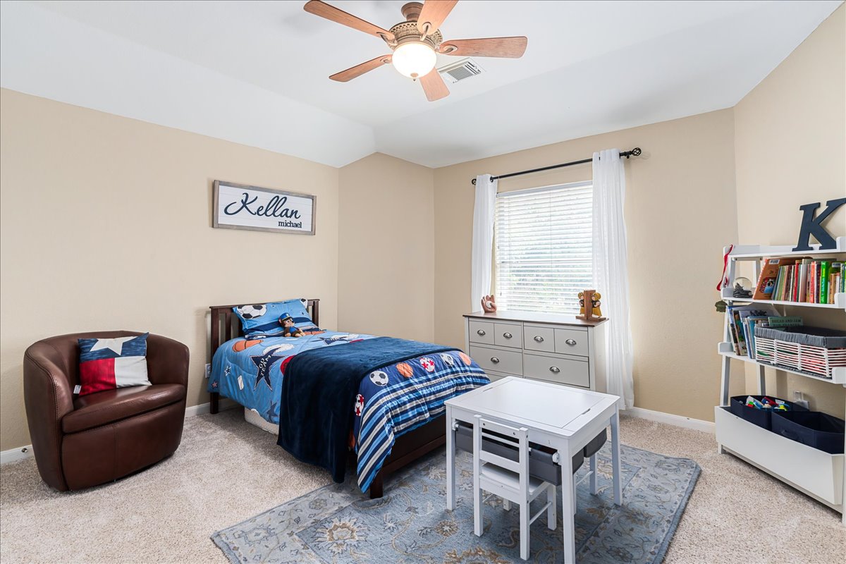 58 Cottondale Road The Hills, TX 78738 - Photo 27 of 40 a bedroom with a bed furniture and a window