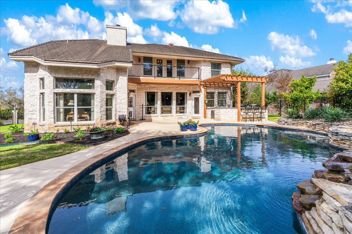 58 Cottondale Road The Hills, TX 78738 - Photo 29 of 40 a view of a house with pool and chairs