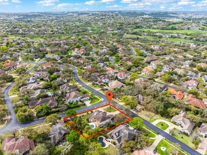 an aerial view of residential houses with outdoor space